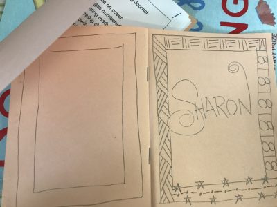 cover with name and frame with repeating patterns